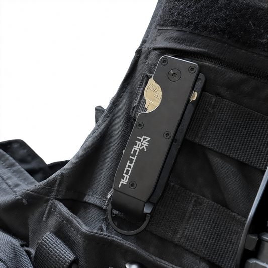 NK Tactical KeyPoint compact key organizer mounted on a law enforcement tactical vest with keys secured inside and attachment ring below.