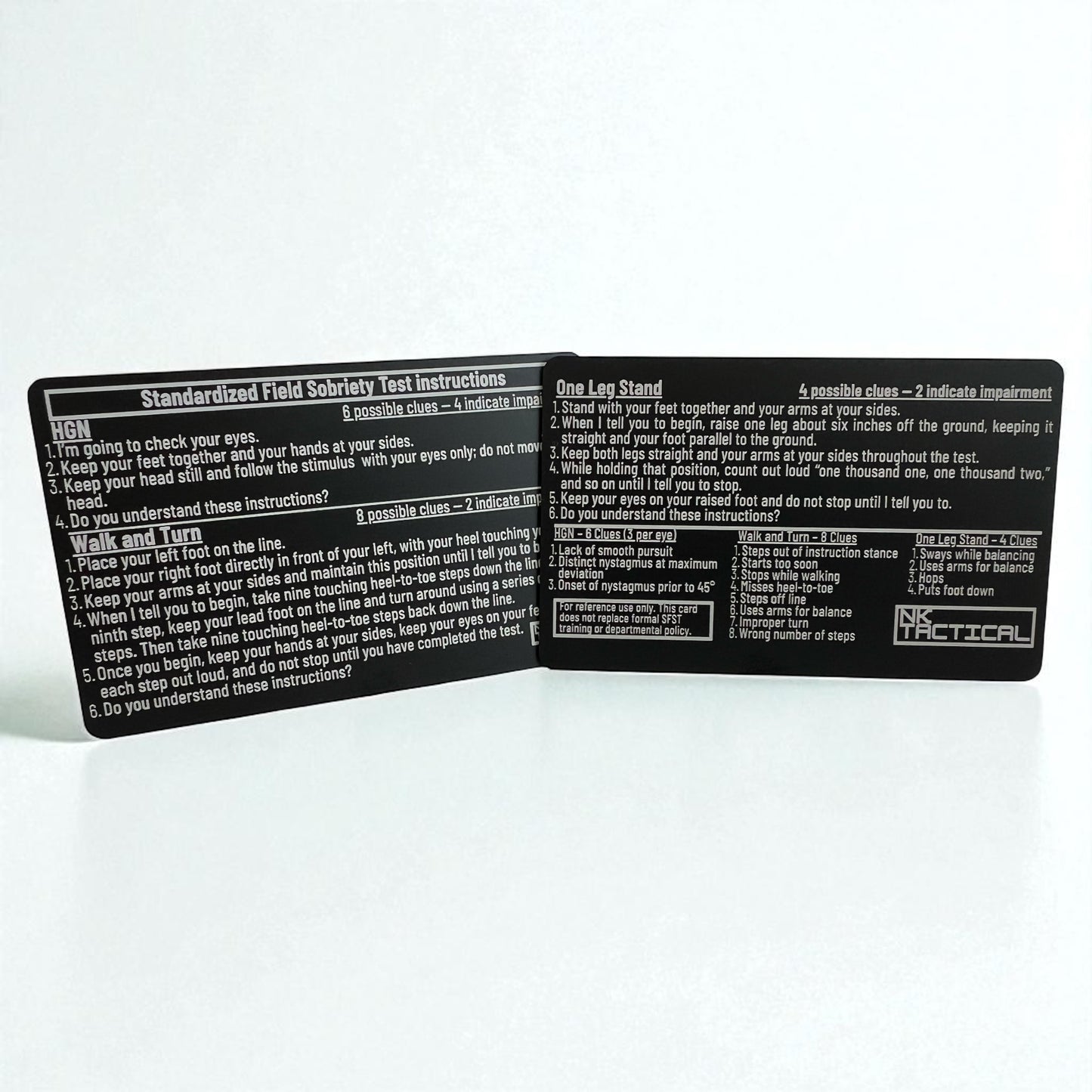 Close-up of two metal SFST instruction cards showing detailed field sobriety test instructions and engraved NK Tactical branding.