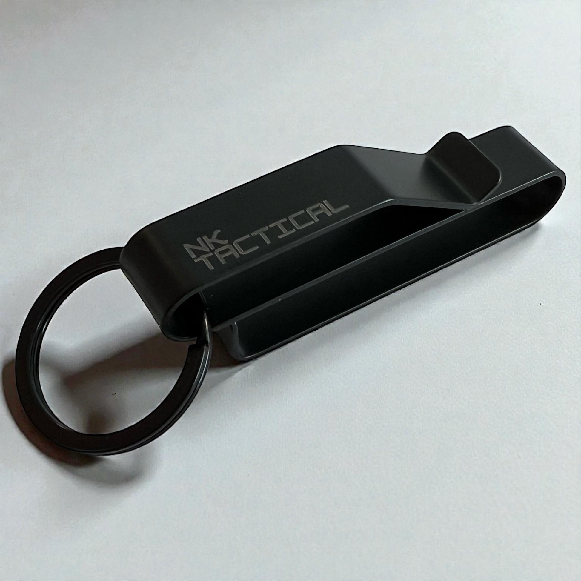 NK Tactical KeyHold belt-mounted key holder assembled with key ring showing low-profile wire-formed stainless steel design