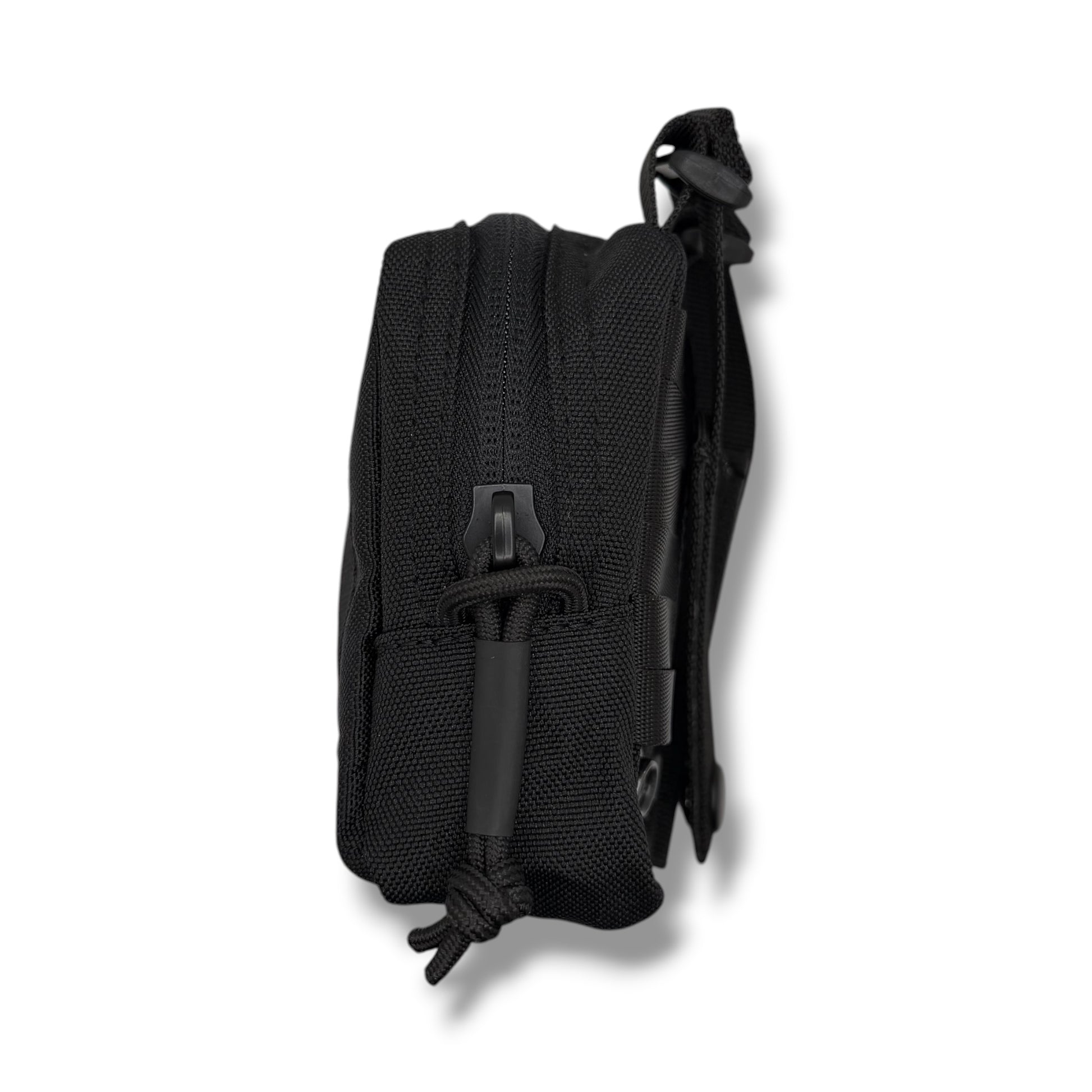 Side view of GloveNest MOLLE glove pouch showing zipper and compact nylon construction