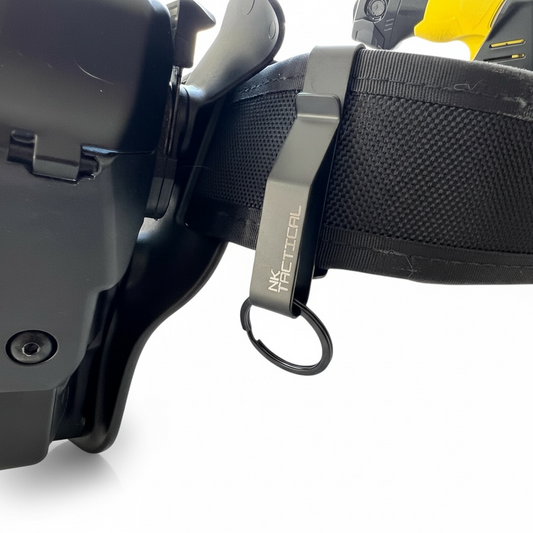 NK Tactical KeyHold™ duty key clip mounted on a law enforcement duty belt with an attached split ring for secure, quick-access key retention.