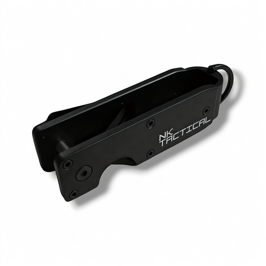 Open angled view of the NK Tactical KeyPoint compact key organizer showing the internal key storage channel and integrated attachment ring.